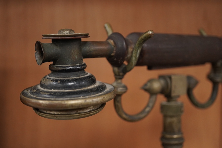 An early 20th century mahogany cased telephone, possibly by Ericsson, with handset on decorative cradle and five switchboard selector levers, stamped ‘Patent’ to front of the case, and with paper label underneath reading